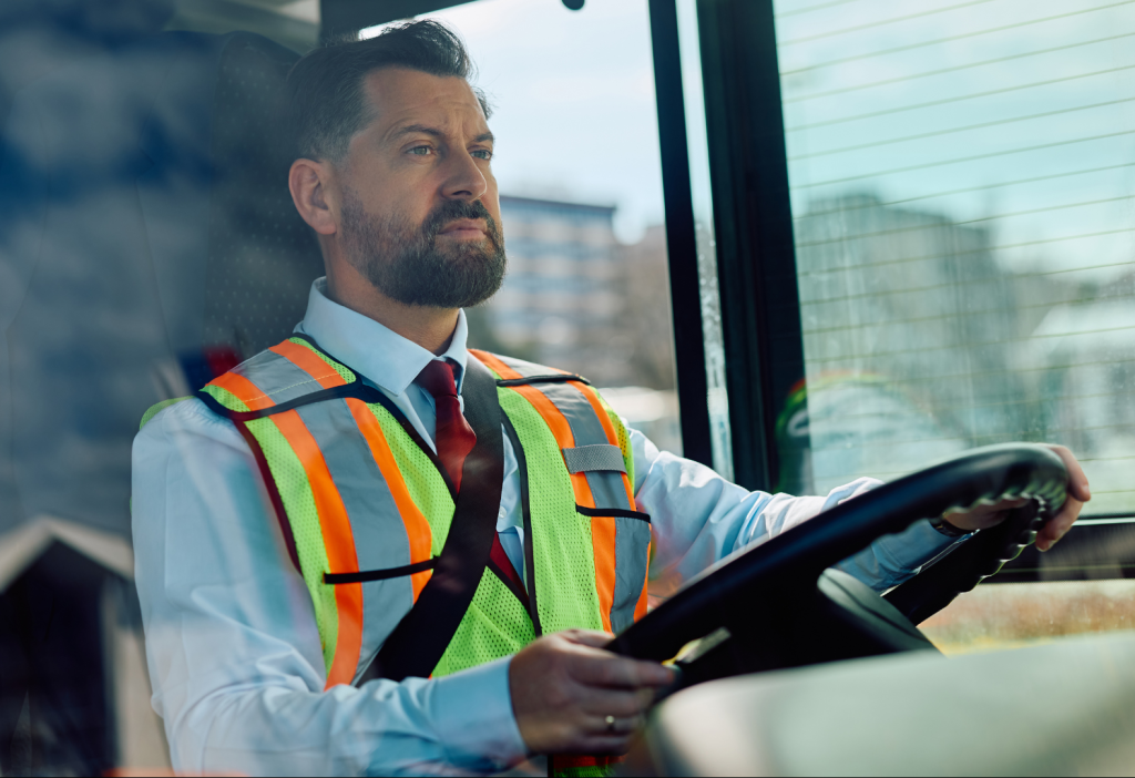 Mid adult man driving a school bus